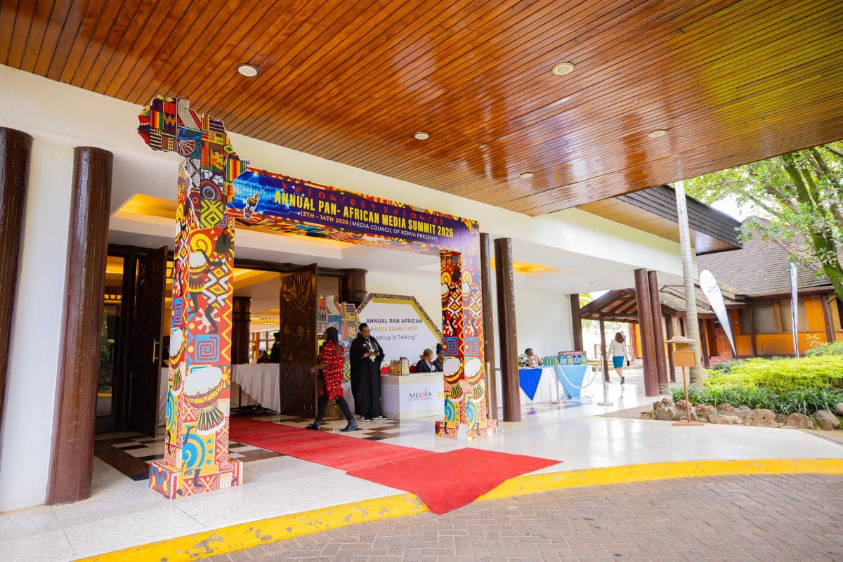 Exhibition booths and visitors under event tent